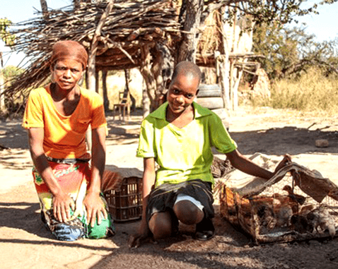 A woman, her daughter and their chickens